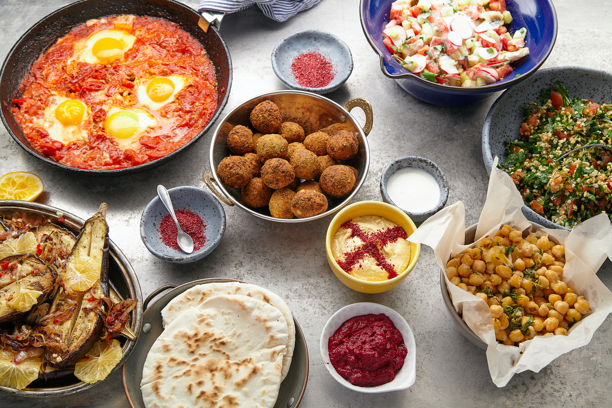 Overhead image of traditional Jewish and Middle Eastern food
