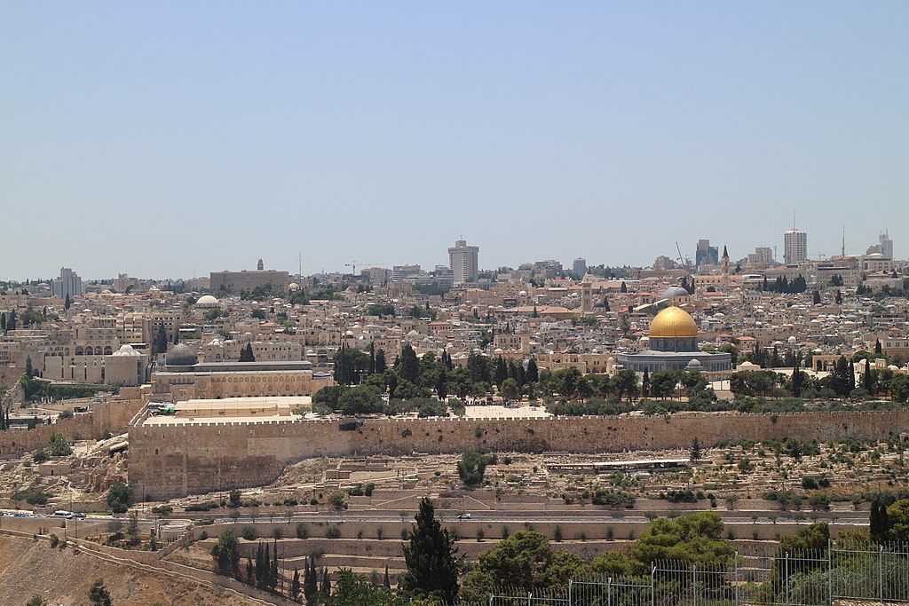 A view of a city with a golden dome on the right