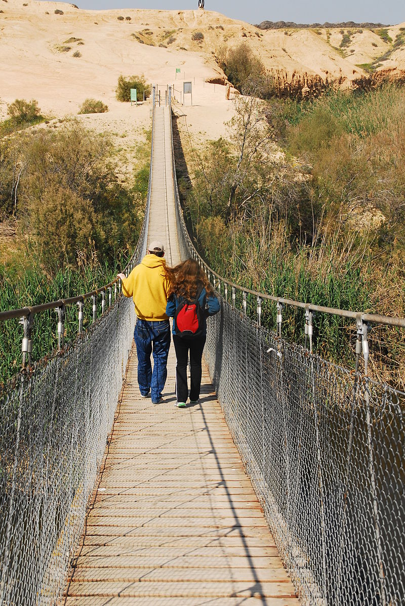 two people walking in the bridge