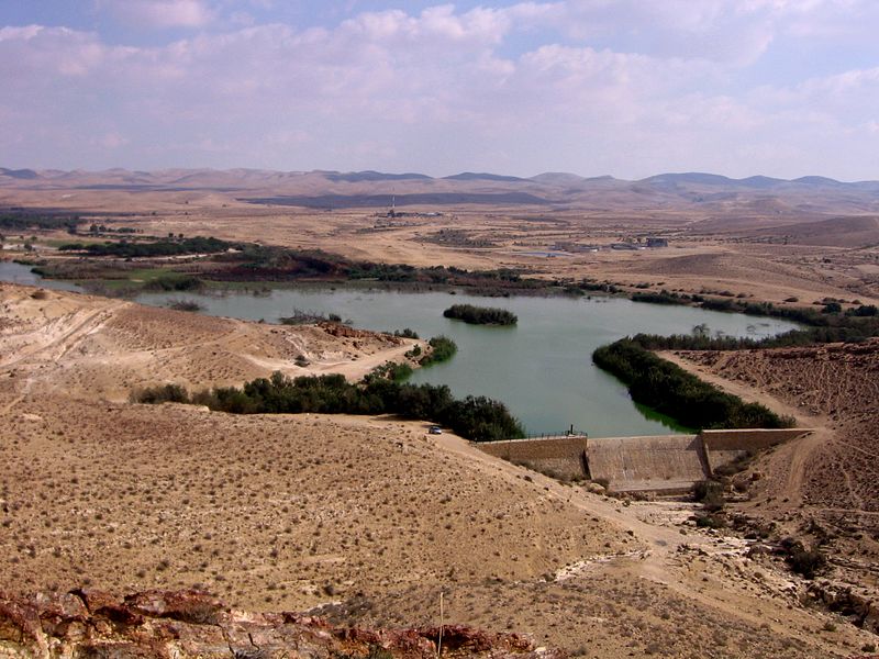 a lake in the middle of a barren land