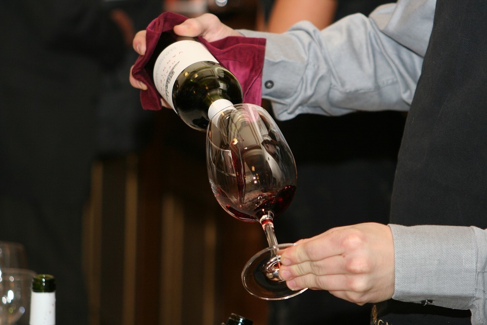 a goblet being poured with wine
