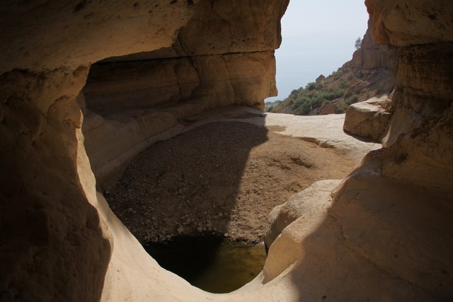 cave and a small pool