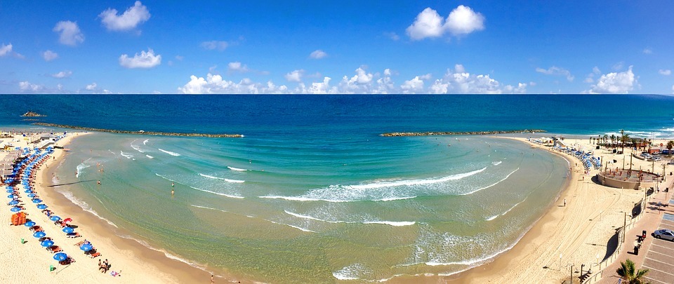 panoramic view of a beach and blue sea