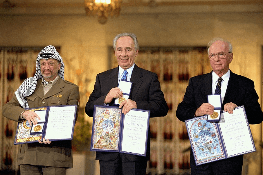 Yasser Arafat, Shimon Peres, and Yitzhak Rabin receiving the Nobel Peace Prize