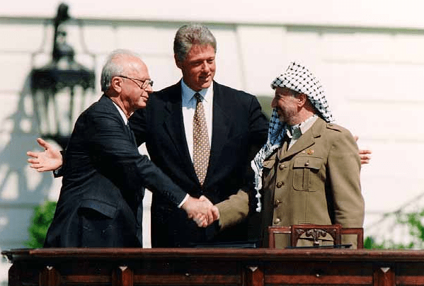 Yitzhak Rabin, U.S. President Bill Clinton, and Yasser Arafat during the Oslo Accords in 1993