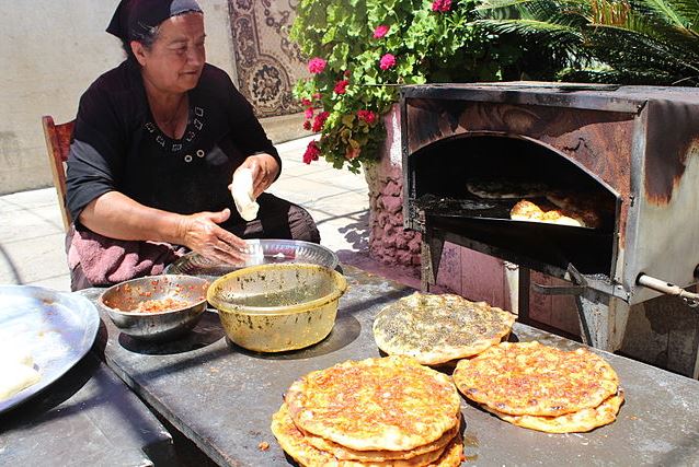 A woman making pita in the Druze village of Isfiya