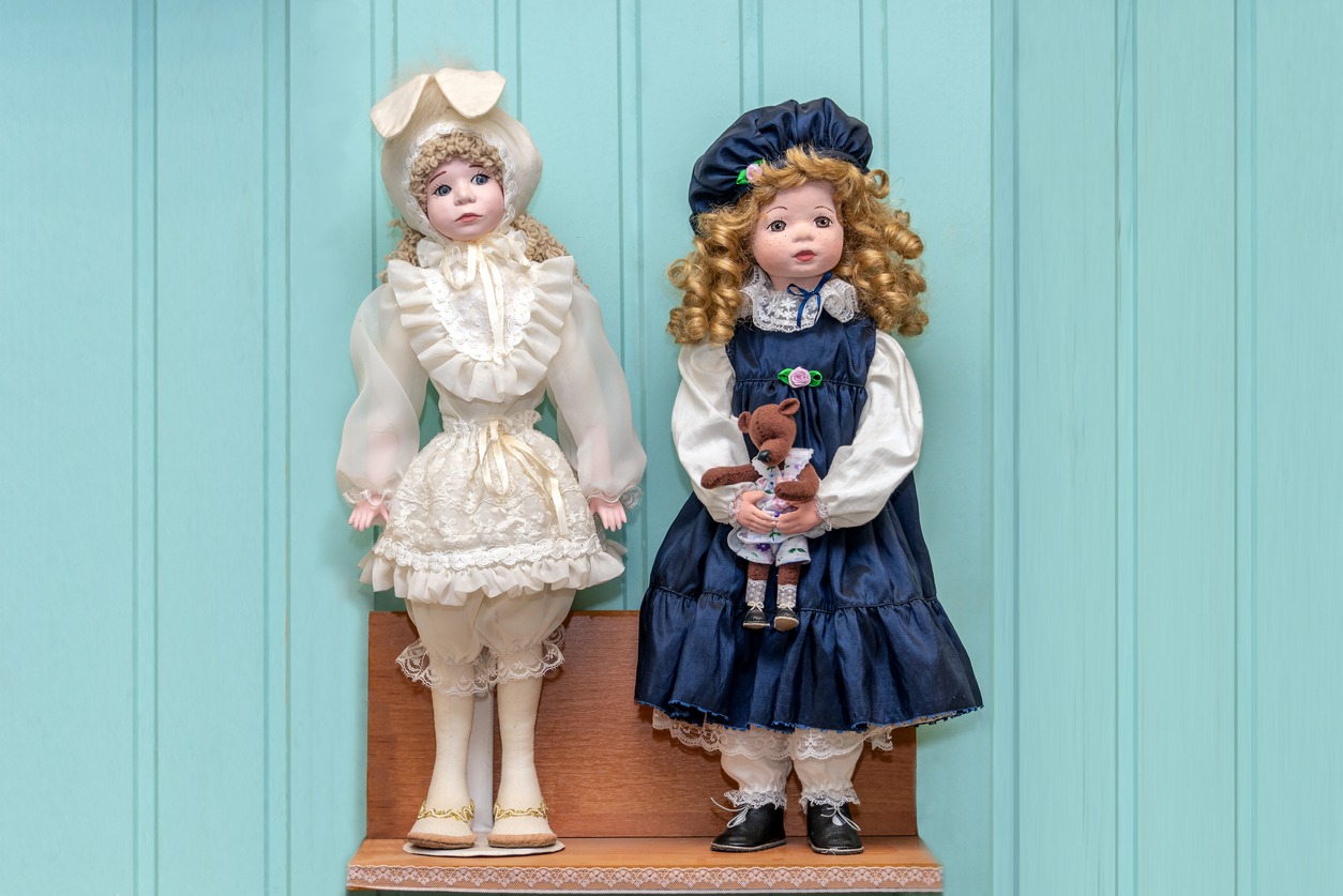 two dolls in dresses